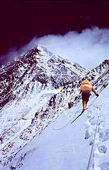 lone person approaching peak of mt. everest