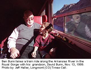 photo of ben with his grandson on a train