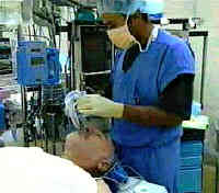 frame from video showing man about to have surgery